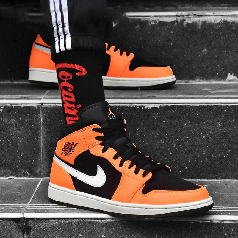 air jordan 1 mid orange on feet